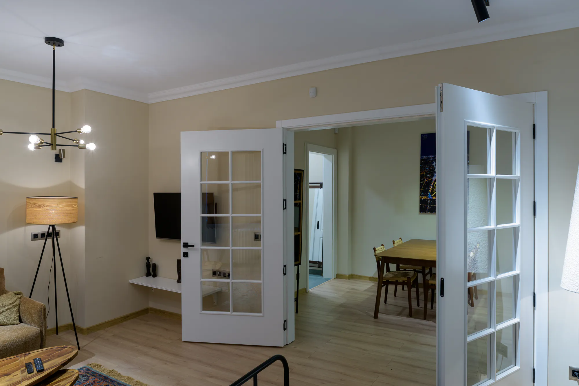 Living room with open double glazed doors to the dining area