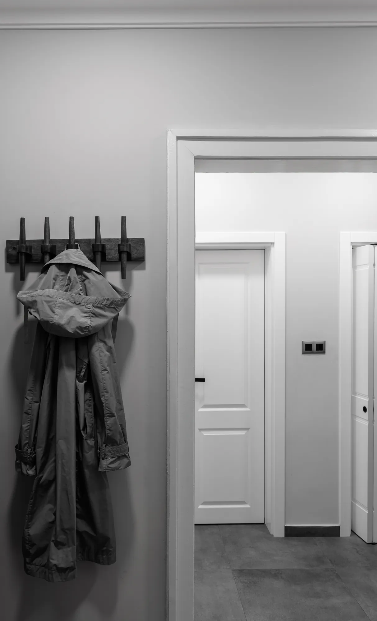 Coat rack in the entrance, black and white photo