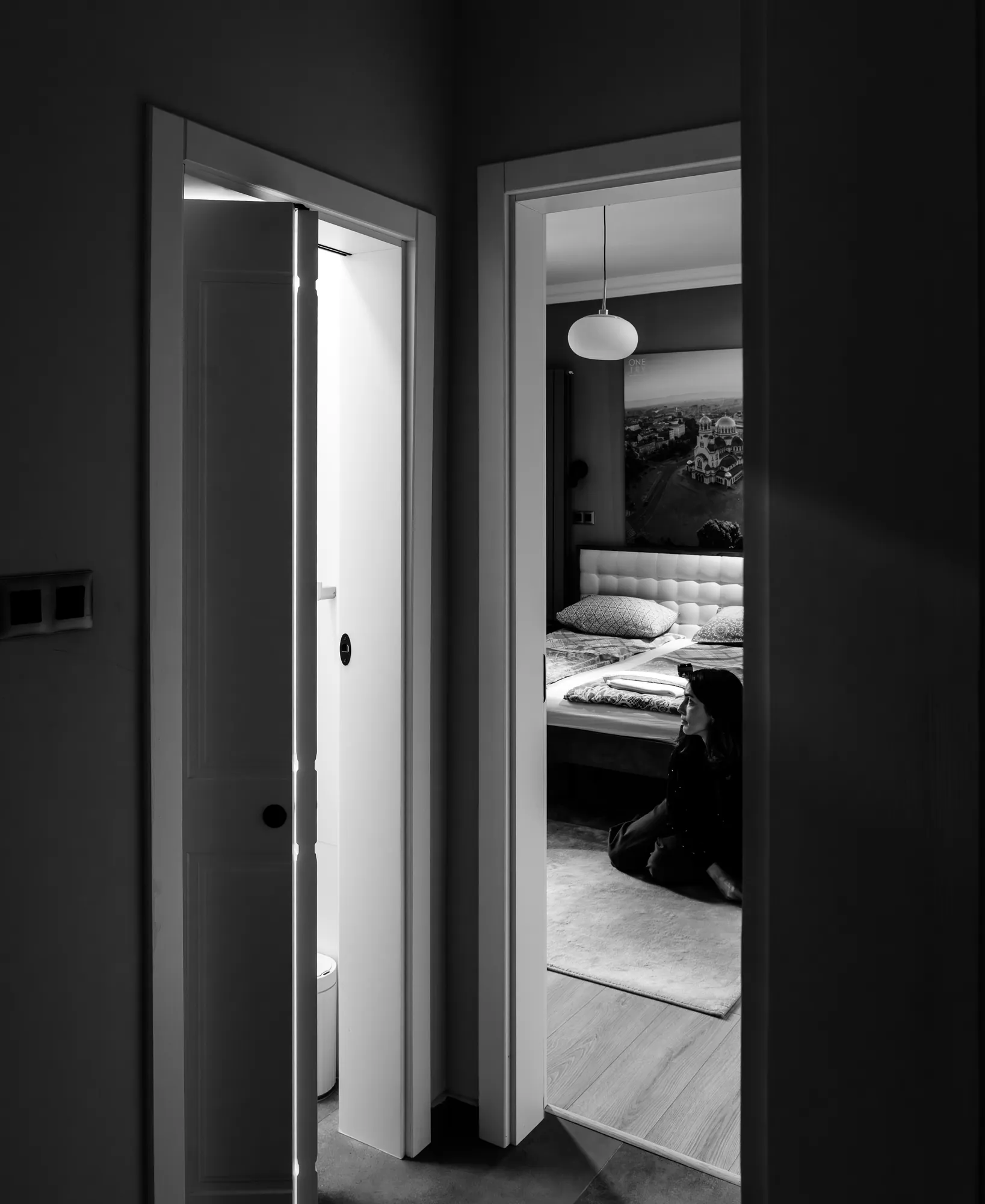 View through the doorway into the bedroom, black and white photo