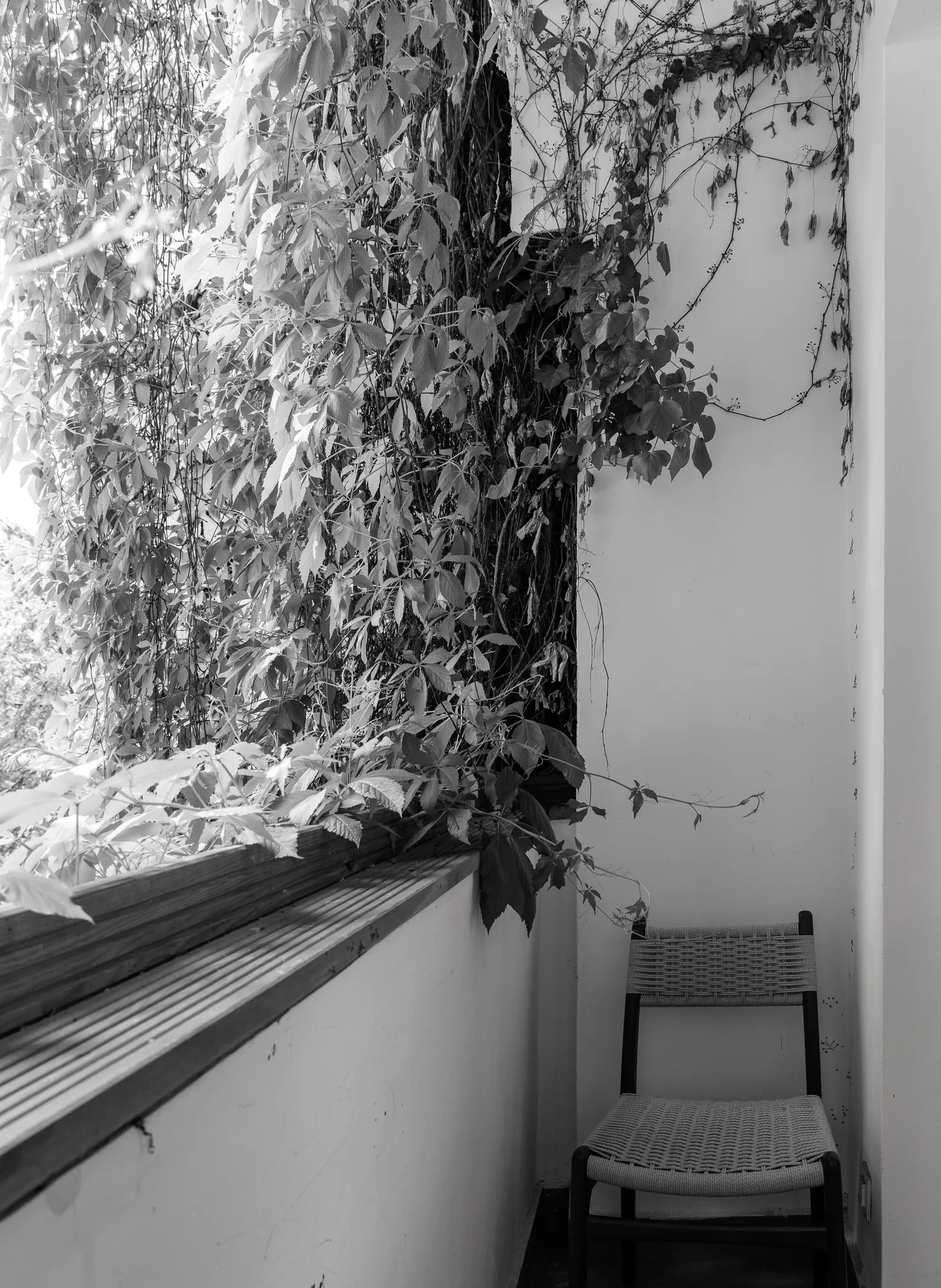 The balcony with the woven chair, black and white photo