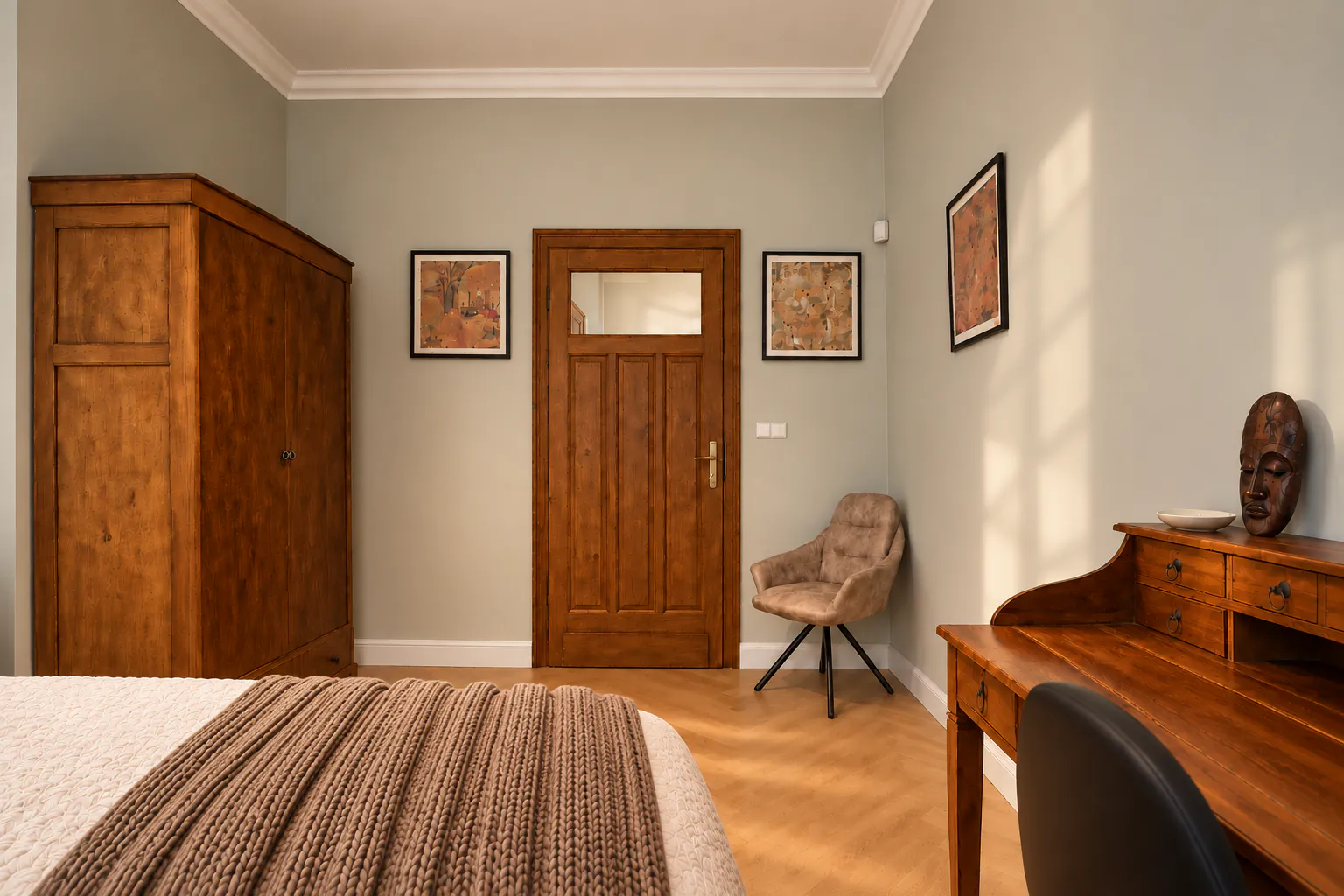 Second bedroom with an antique wooden wardrobe, original door and armchair